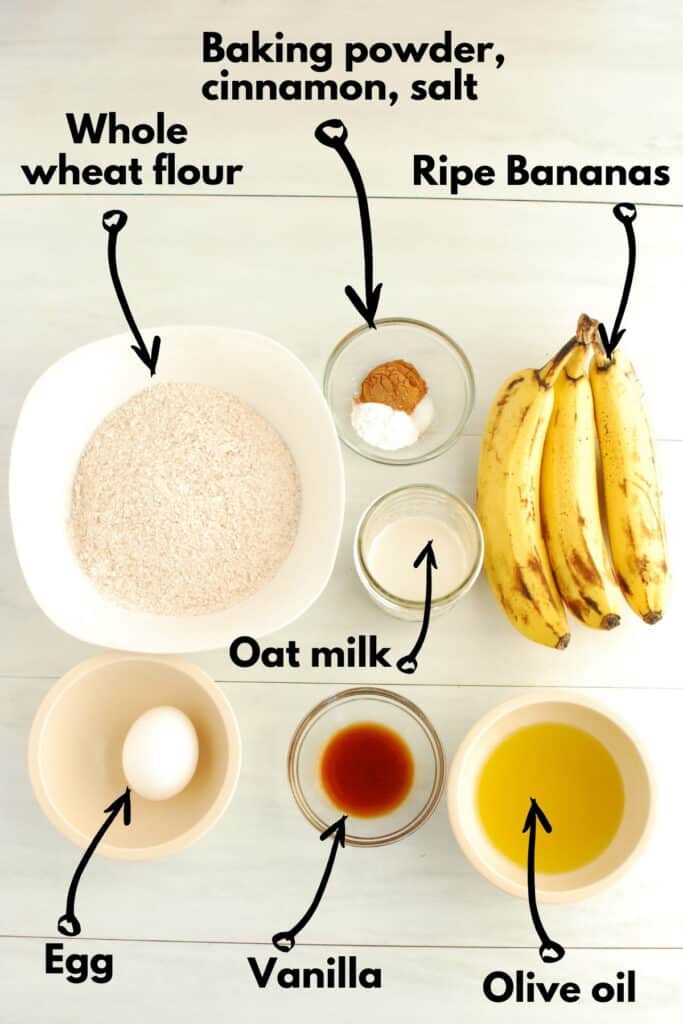 All of the ingrediets - flour, baking powder, cinnamon, salt, bananas, oat milk, egg, vanilla, and olive oil.