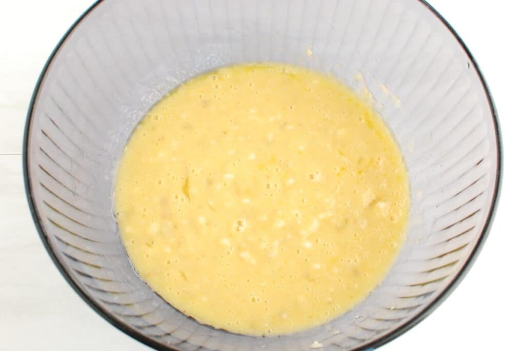 All the wet ingredients for banana muffins in a bowl.