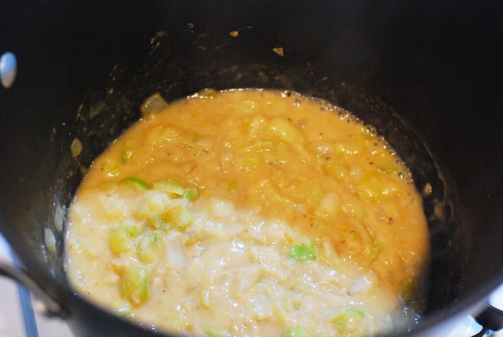 Chicken broth in a pot thickened with flour.