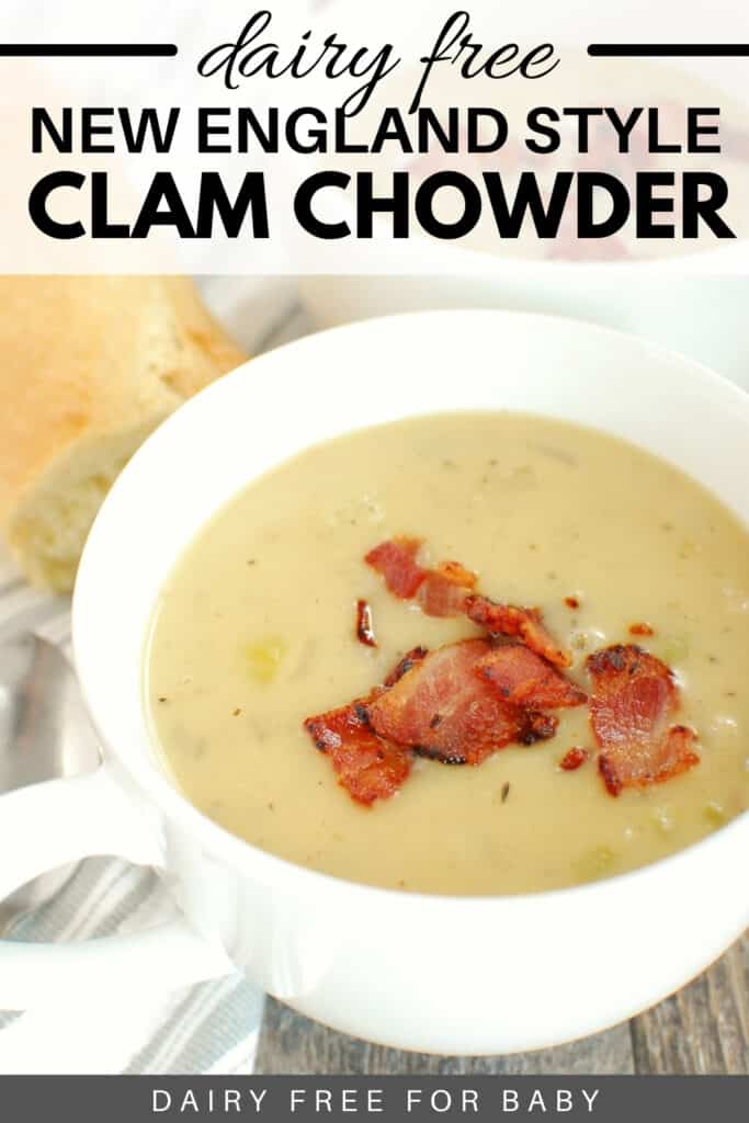 A white mug full of dairy free clam chowder next to a napkin and bread.