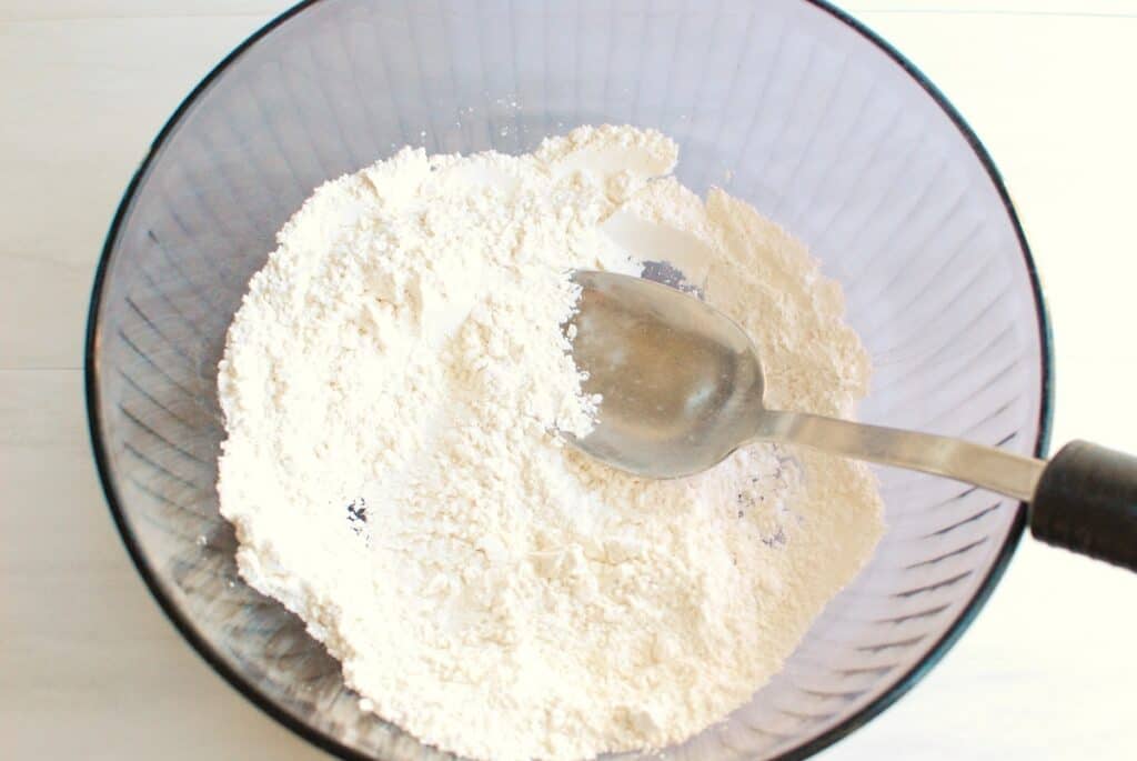 Flour, confectioners sugar, and salt mixed together in a large bowl.
