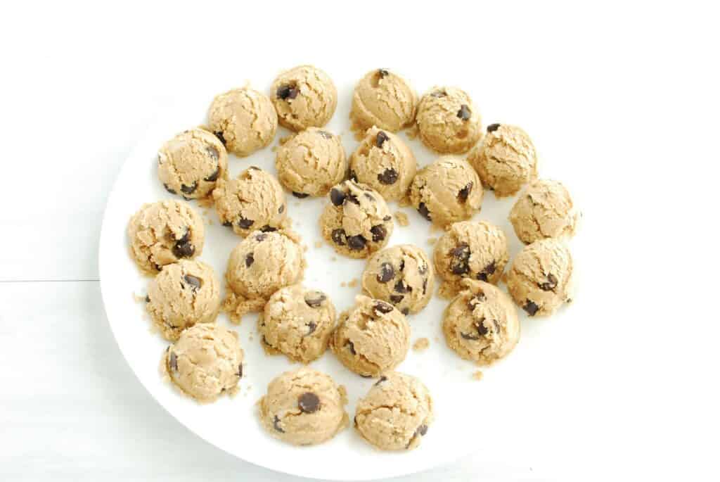 Cookie dough balls on a plate.