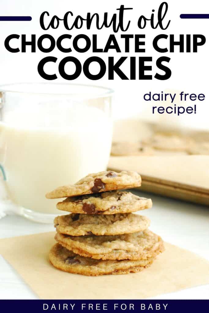 A stack of coconut oil chocolate chip cookies with a glass of oat milk and a baking sheet in the background.