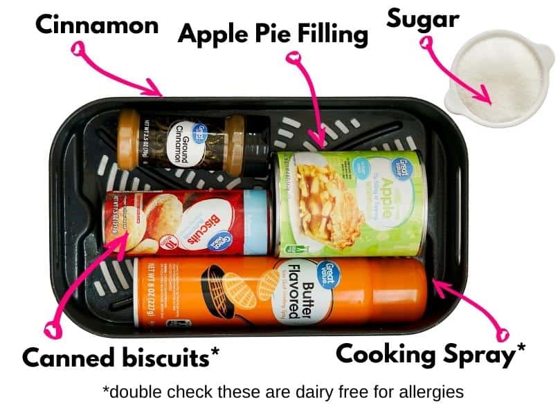 A can of biscuits, cooking spray, cinnamon, apple pie filling, and sugar.
