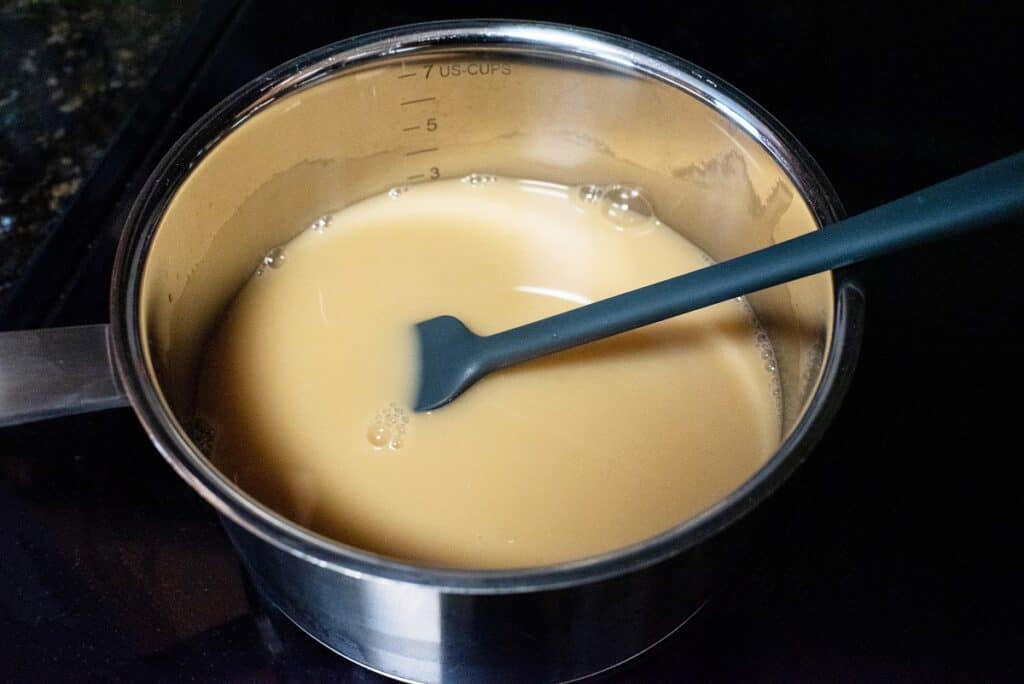 Oat milk, caramel, and vanilla in a pot.