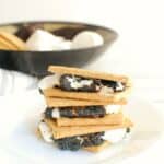 Several dairy free smores stacked on top of each other.