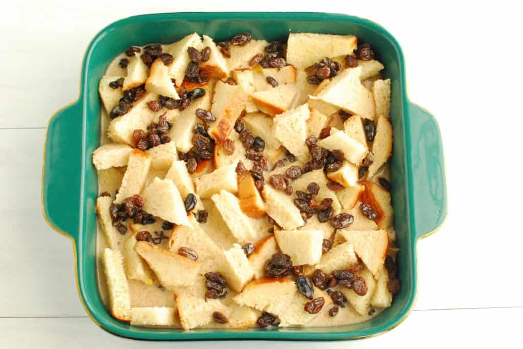 A baking dish of bread pudding before baking.
