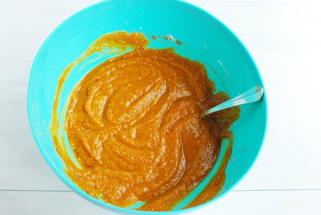 Pumpkin pie filling mixed together in a bowl.