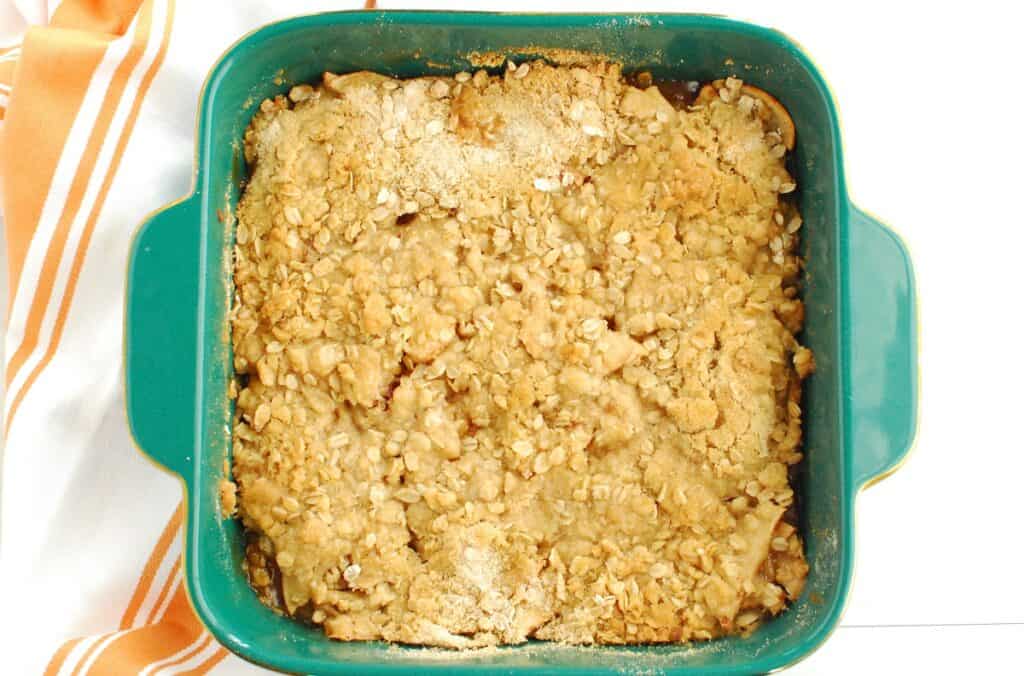 Cooked dairy free apple crisp in a baking dish.