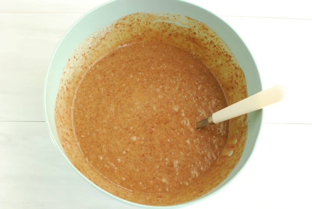 Chocolate pie filling ingredients mixed together in a bowl.