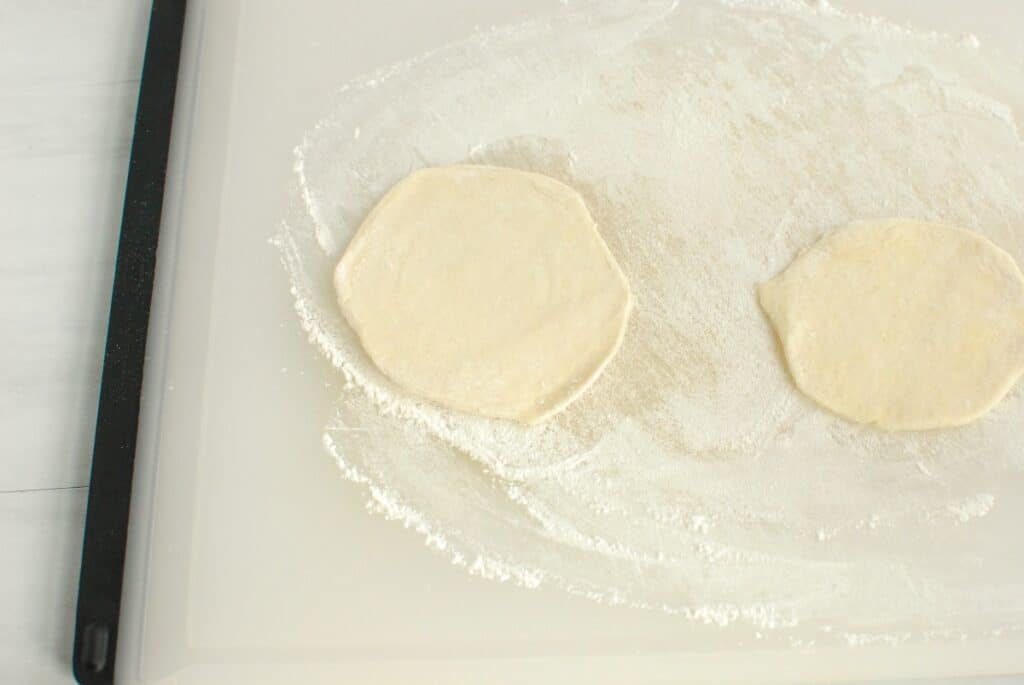 Biscuit dough flattened out.