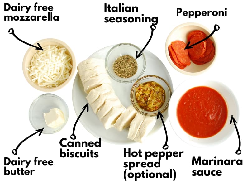 Dairy free mozzarella, dairy free butter, canned biscuits, hot pepper spread, italian seasoning, pepperoni, and marinara sauce.