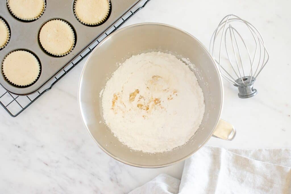 All frosting ingredients combined in a mixing bowl.