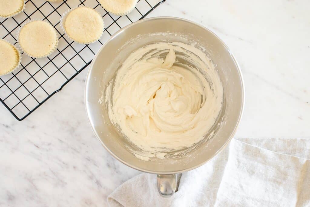 Dairy free buttercream in a silver mixing bowl.