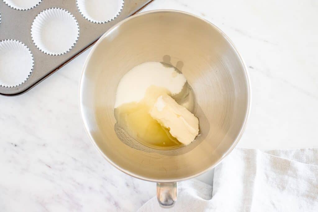 Oil, dairy-free butter, and sugar in a mixing bowl.