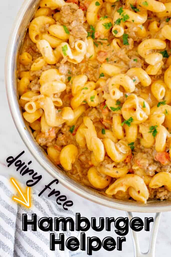 Close up of a sauté pan filled with just-cooked dairy free hamburger helper, with a text overlay with the name of the recipe.