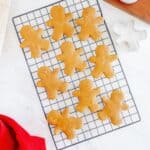 A cooling rack with dairy free gingerbread cookies on it.