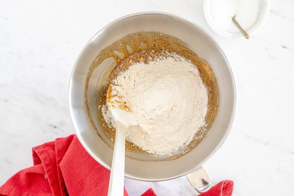 Flour mixture added to the bowl of wet ingredients.