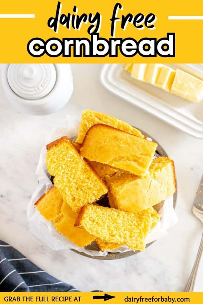 A bowl filled with pieces of dairy free cornbread with a text overlay with the name of the recipe.