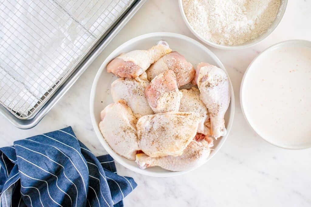 Chicken seasoned with salt and pepper.