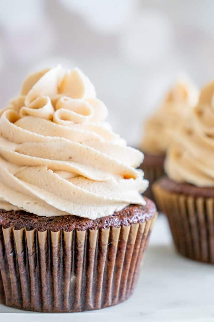 Peanut butter frosting on a chocolate cupcake.