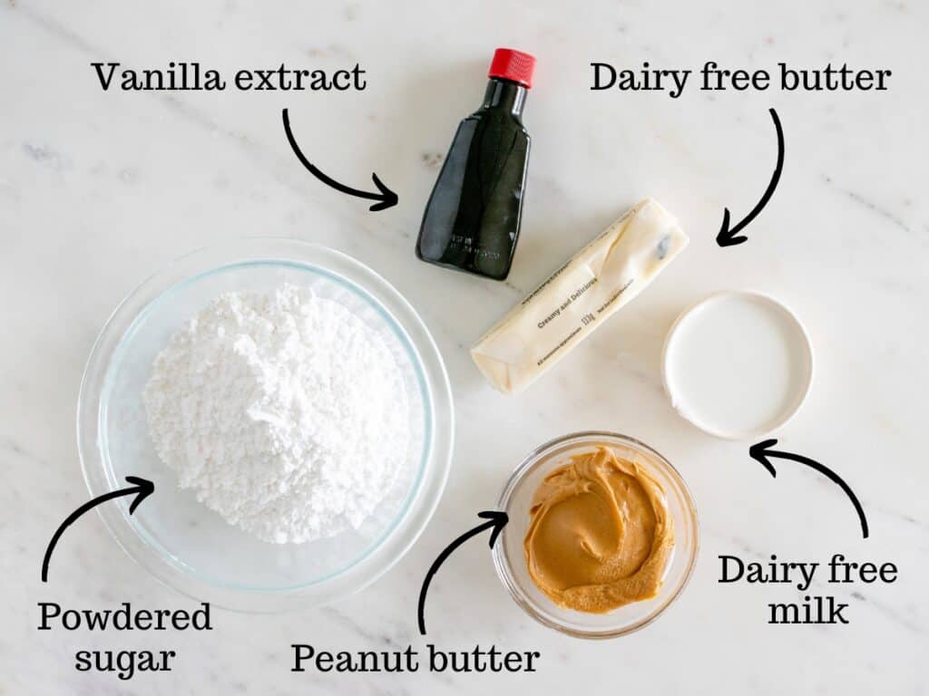 All of the ingredients for the peanut butter frosting laid out on a table.