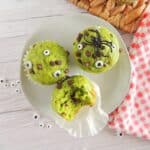 Three Halloween Muffins on a white plate.