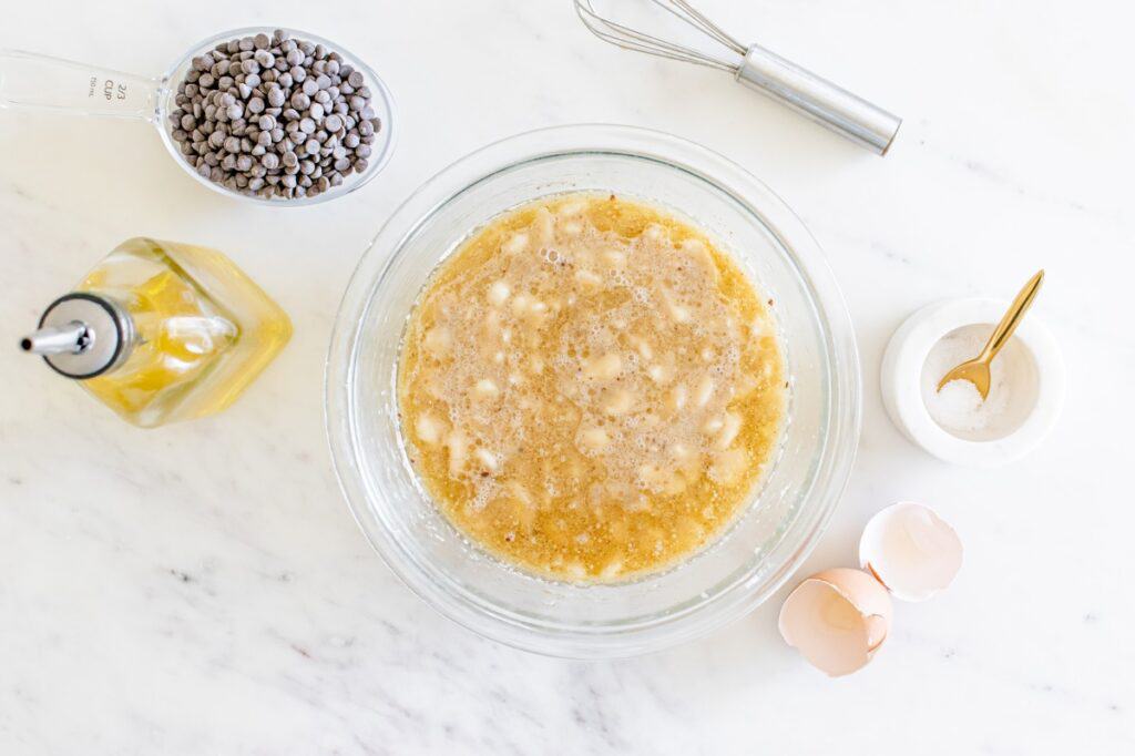 All of the wet ingredients mixed together in a glass mixing bowl.