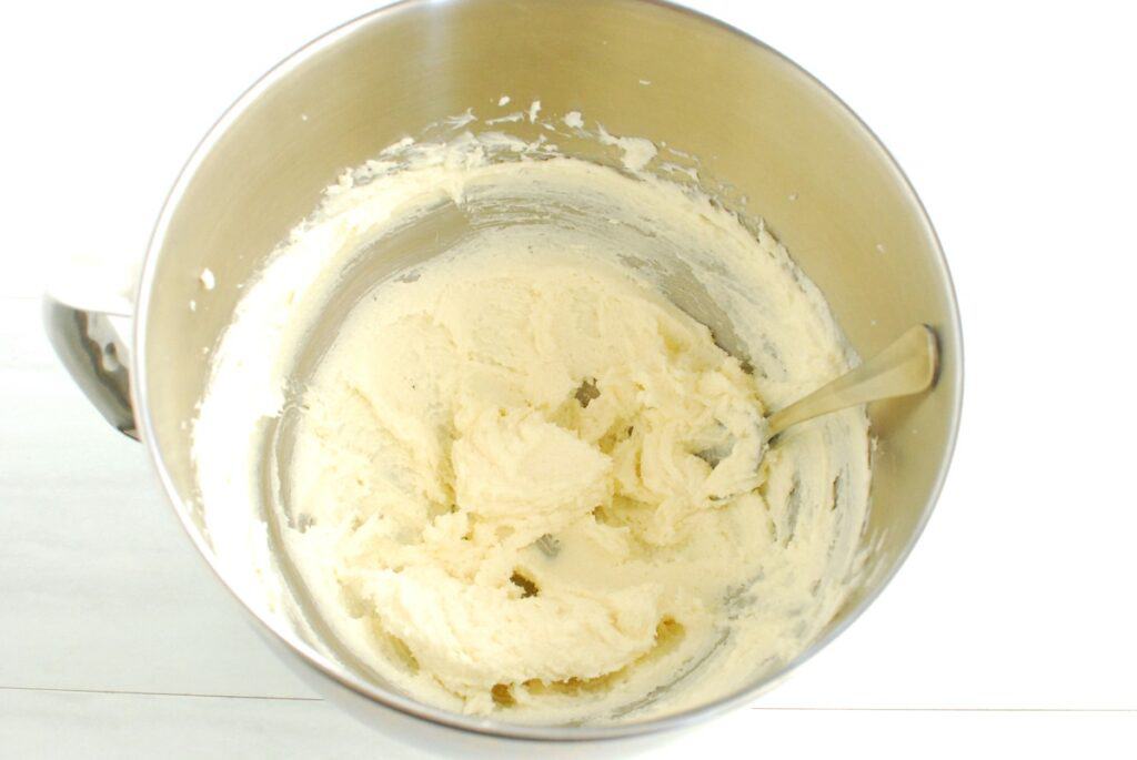 A mixing bowl with dairy-free butter and sugar creamed together.
