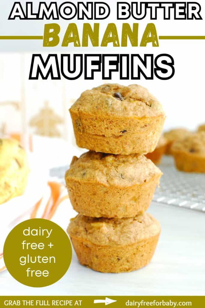 Several almond butter banana muffins stacked on top of each other with a text overlay with the name of the recipe.