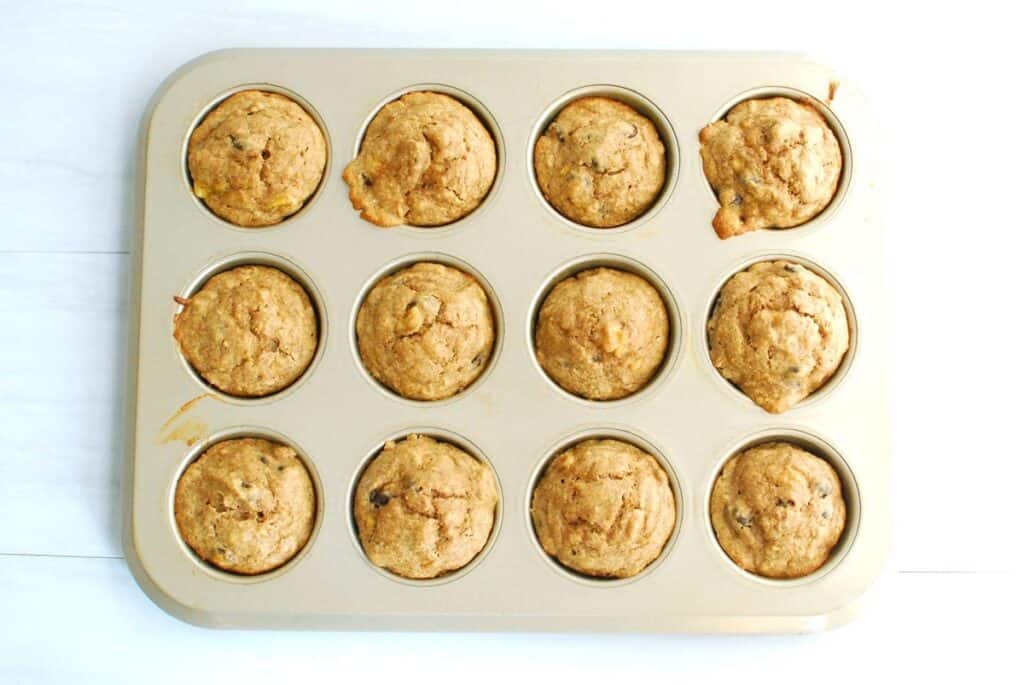 A muffin tin with freshly baked muffins.