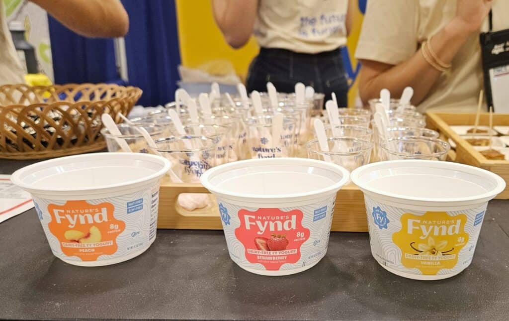 Three containers of Fynd dairy free yogurt.