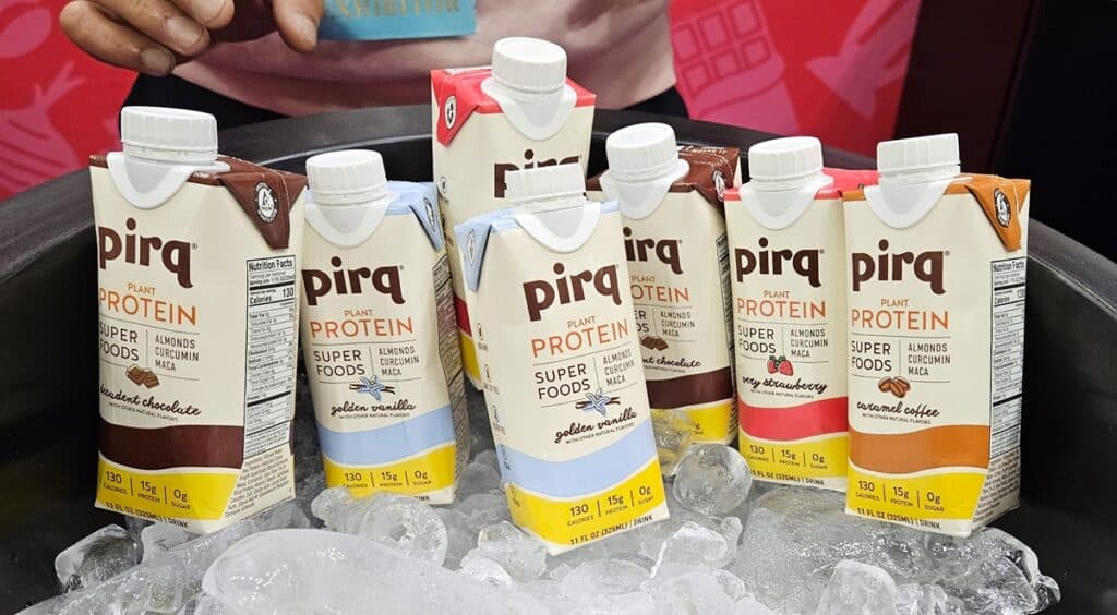 Pirq plant protein shakes sitting on ice.