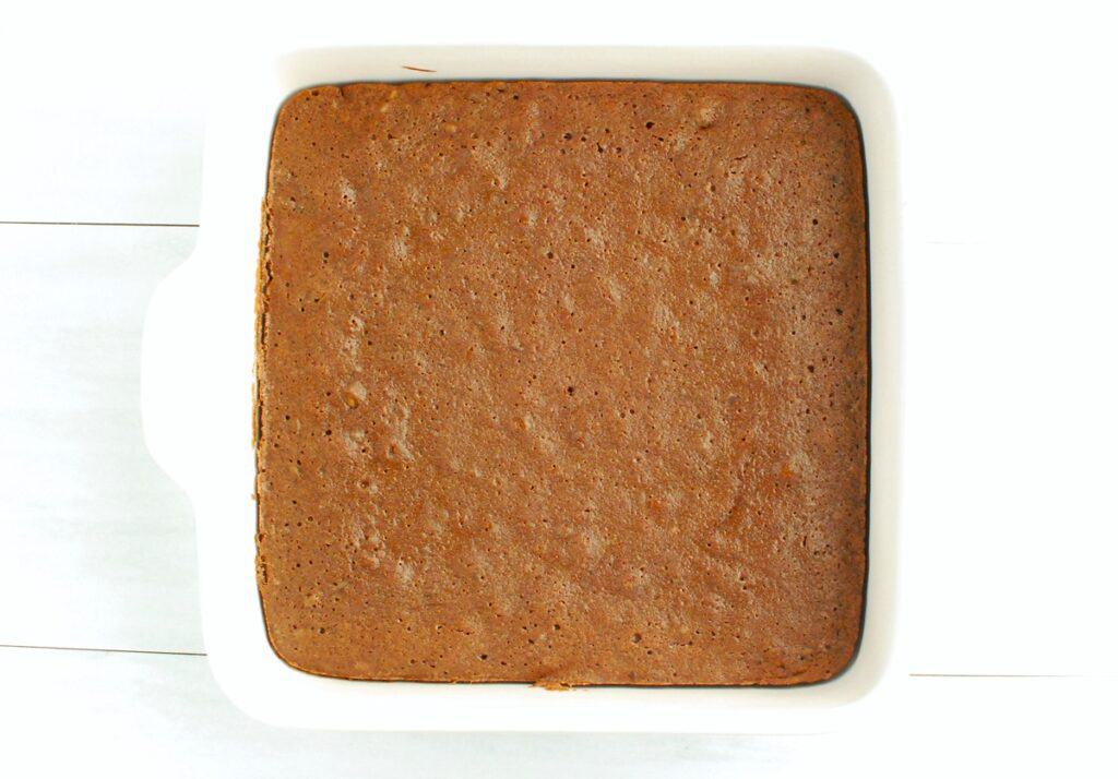 Just-baked brownies in an 8x8 baking dish.