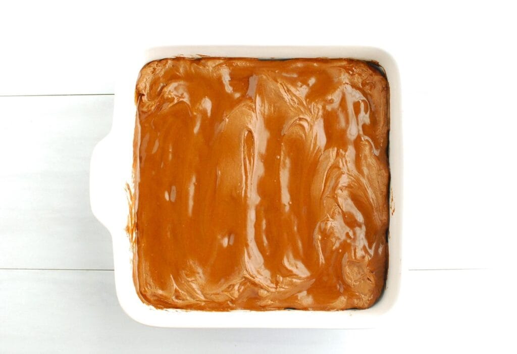 Frosting melting on top of the brownies.