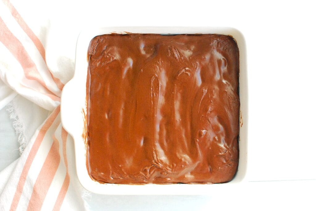Frosting re-solidified on top of the brownies.