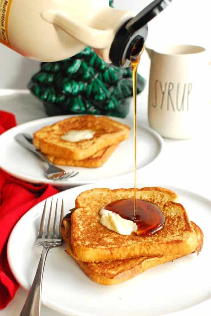 Syrup being drizzled on dairy free eggnog French toast.