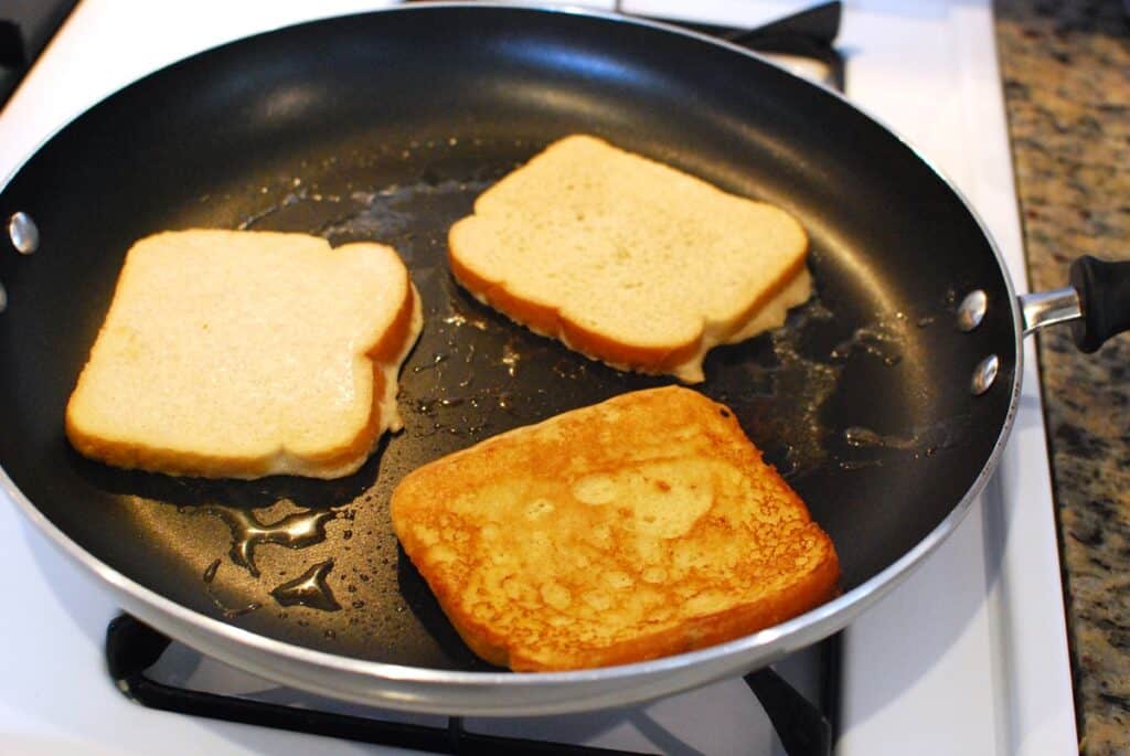 French toast cooking in a skillet.