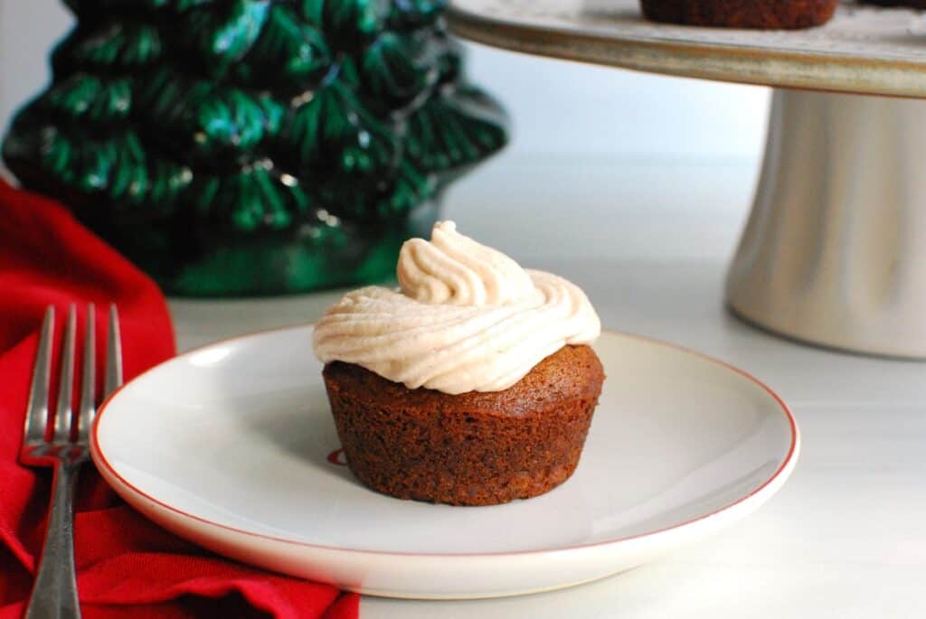 A dairy free gingerbread cupcake on a plate.
