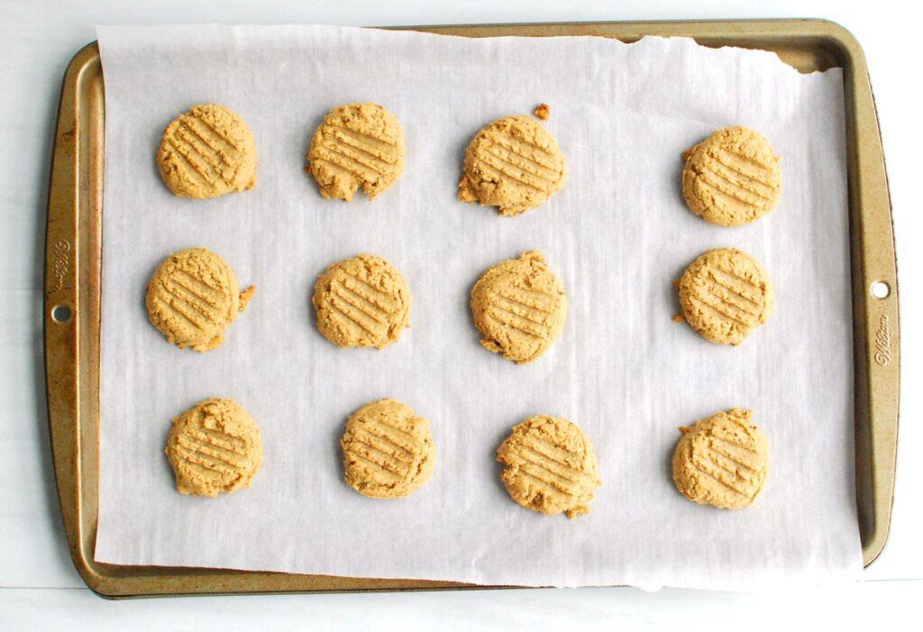 A baking sheet with just-baked cashew butter chai cookies.