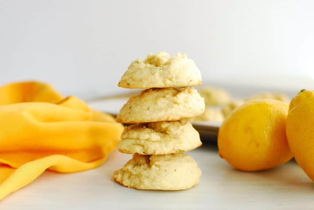 A stack of four lemon olive oil cookies.