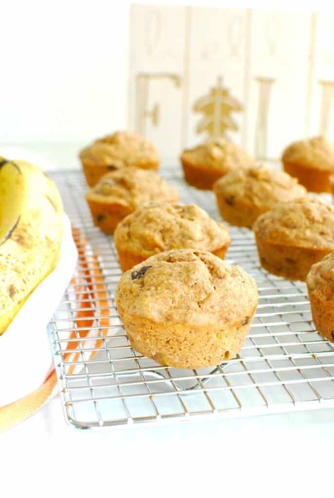 Almond butter banana muffins on a cooling rack.