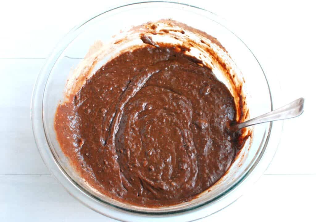 Cupcake batter in a glass mixing bowl.