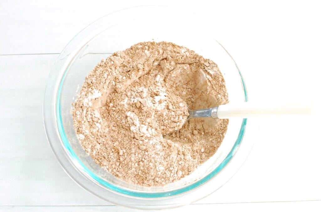 Flour, cocoa powder, baking powder, baking soda, and salt in a bowl.