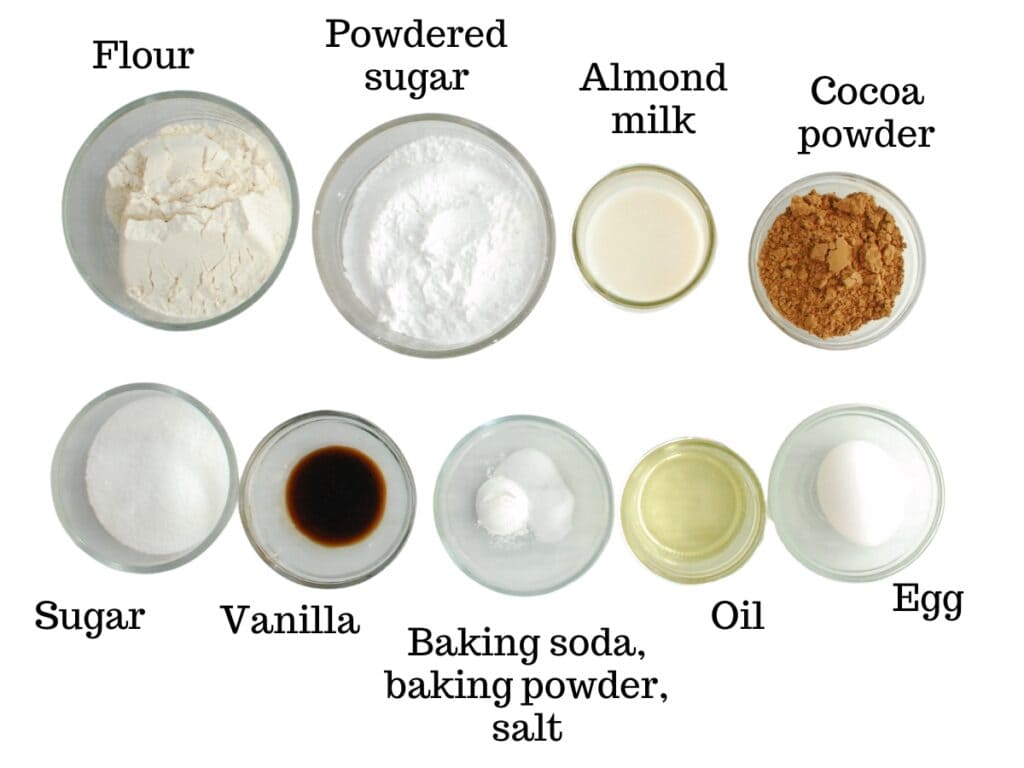 Flour, powdered sugar, almond milk, cocoa powder, sugar, vanilla, baking soda, baking powder, oil, and an egg.