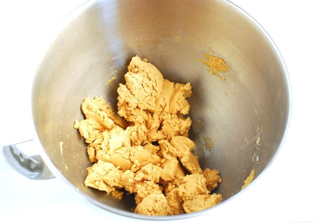 The peanut butter filling in a silver mixing bowl.