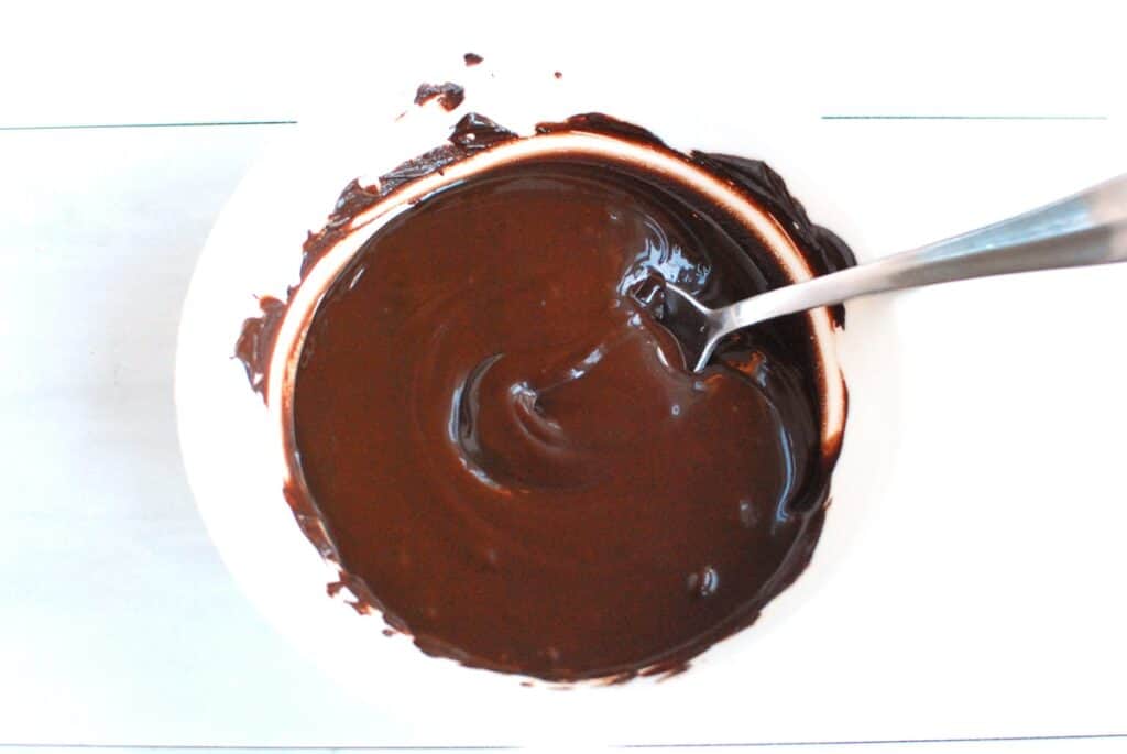 A bowl of melted chocolate and coconut oil.