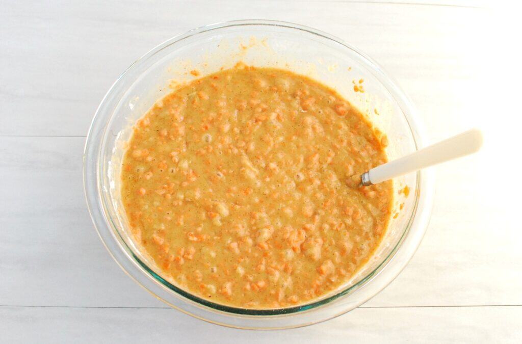 Cake batter in a glass mixing bowl.