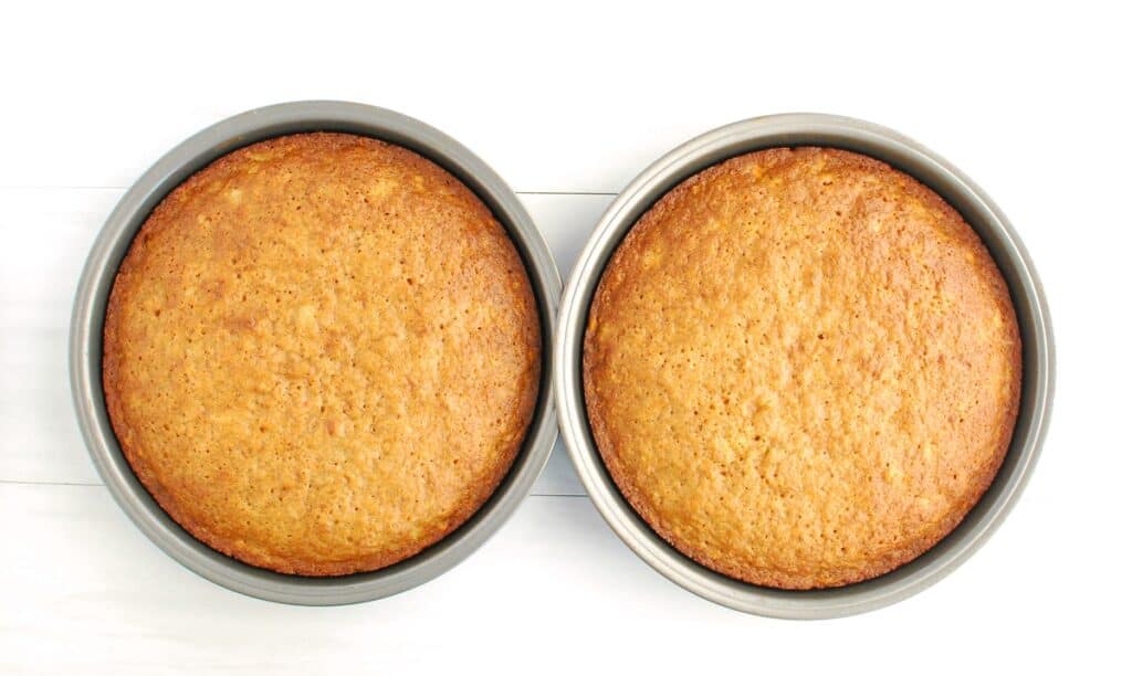 Just-baked carrot cakes in their 9-inch baking pans.