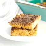 Two chocolate peanut butter rice krispies treats stacked on top of each other.